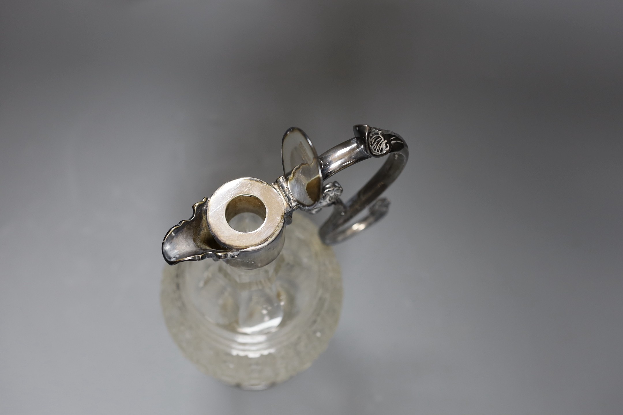 An electroplate mounted cut glass claret jug, 29 cms high